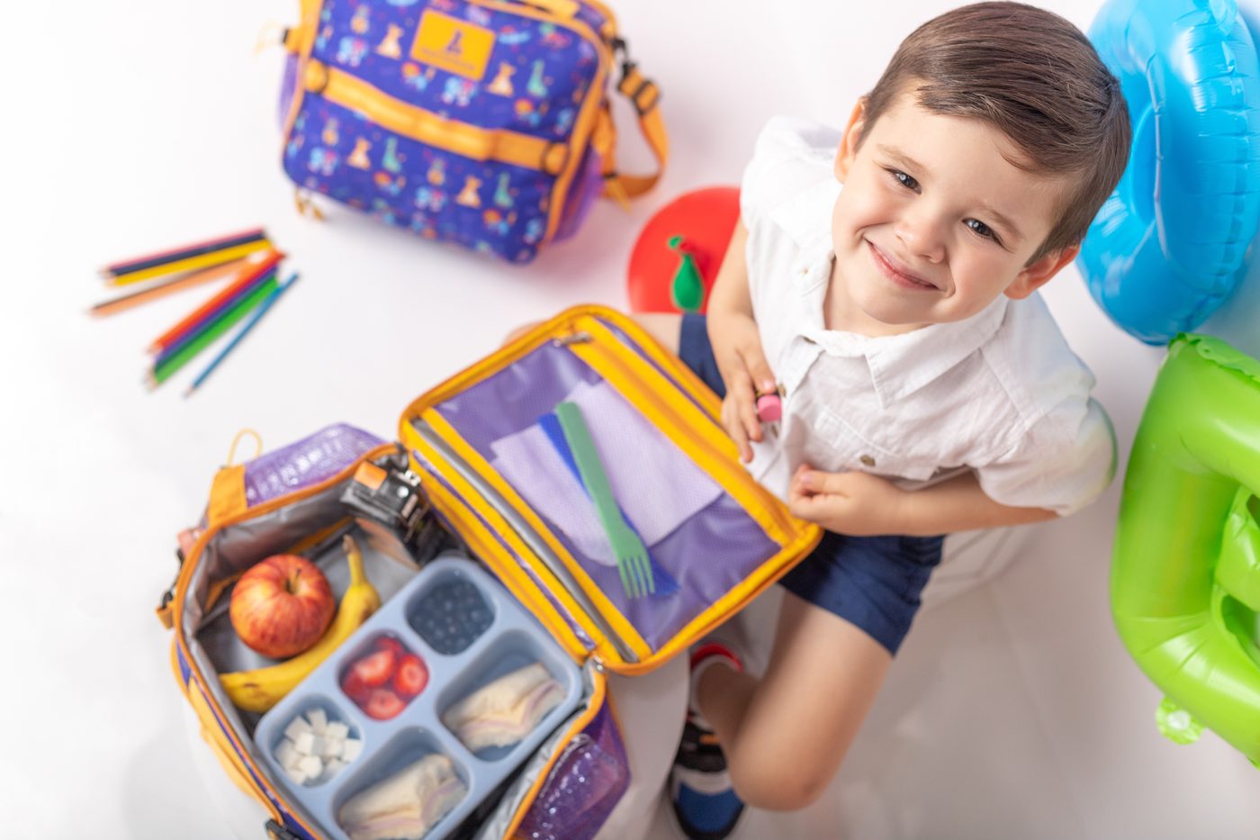Boy with open PACKROO lunch bag
