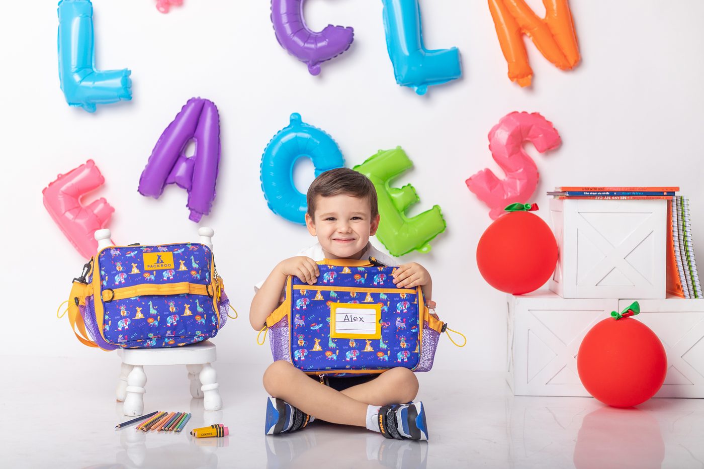 Child holding PACKROO bag